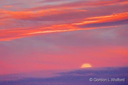 Moonset Into Sunrise Clouds_35389.jpg - Photographed along the Gulf coast near Port Lavaca, Texas, USA.
